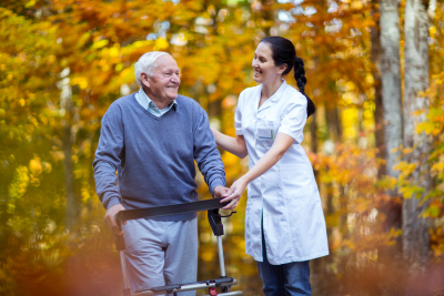 nurse helping elderly senior man