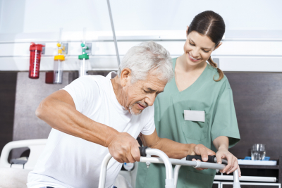 senior patient being assisted by happy female nurse