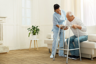 nurse assisting a senior man