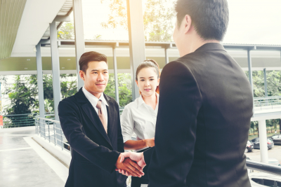 business people shaking their hands